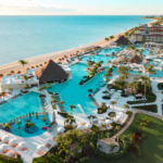 Aerial view of Moon Palace Cancun showing beachfront pools, swim-up bars, and oceanfront resort layout