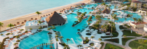 Aerial view of Moon Palace Cancun showing beachfront pools, swim-up bars, and oceanfront resort layout
