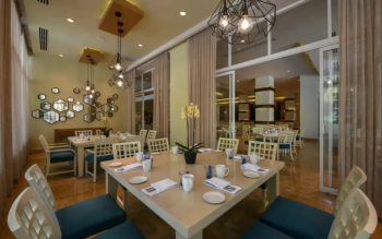 Elegant dining room at Cocotal
restaurant at El Dorado Royale Riviera Maya, serving international breakfast
selections and evening dining.