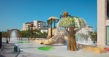 Splash pad and children's playground with tree-shaped fountain at Dreams Playa Mujeres resort Splash pad and children's playground with tree-shaped fountain at Dreams Playa Mujeres resort
